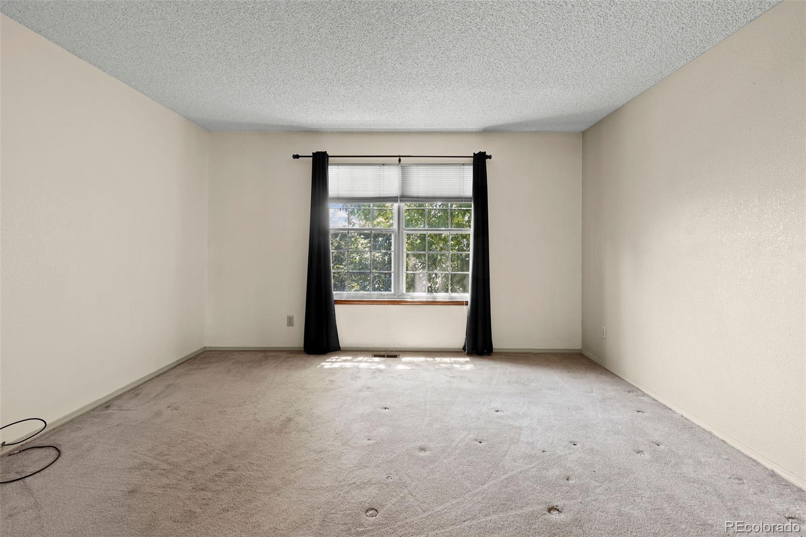 8536 Union Circle Arvada, CO 80005 - Photo 19 of 26 a view of an empty room with a window