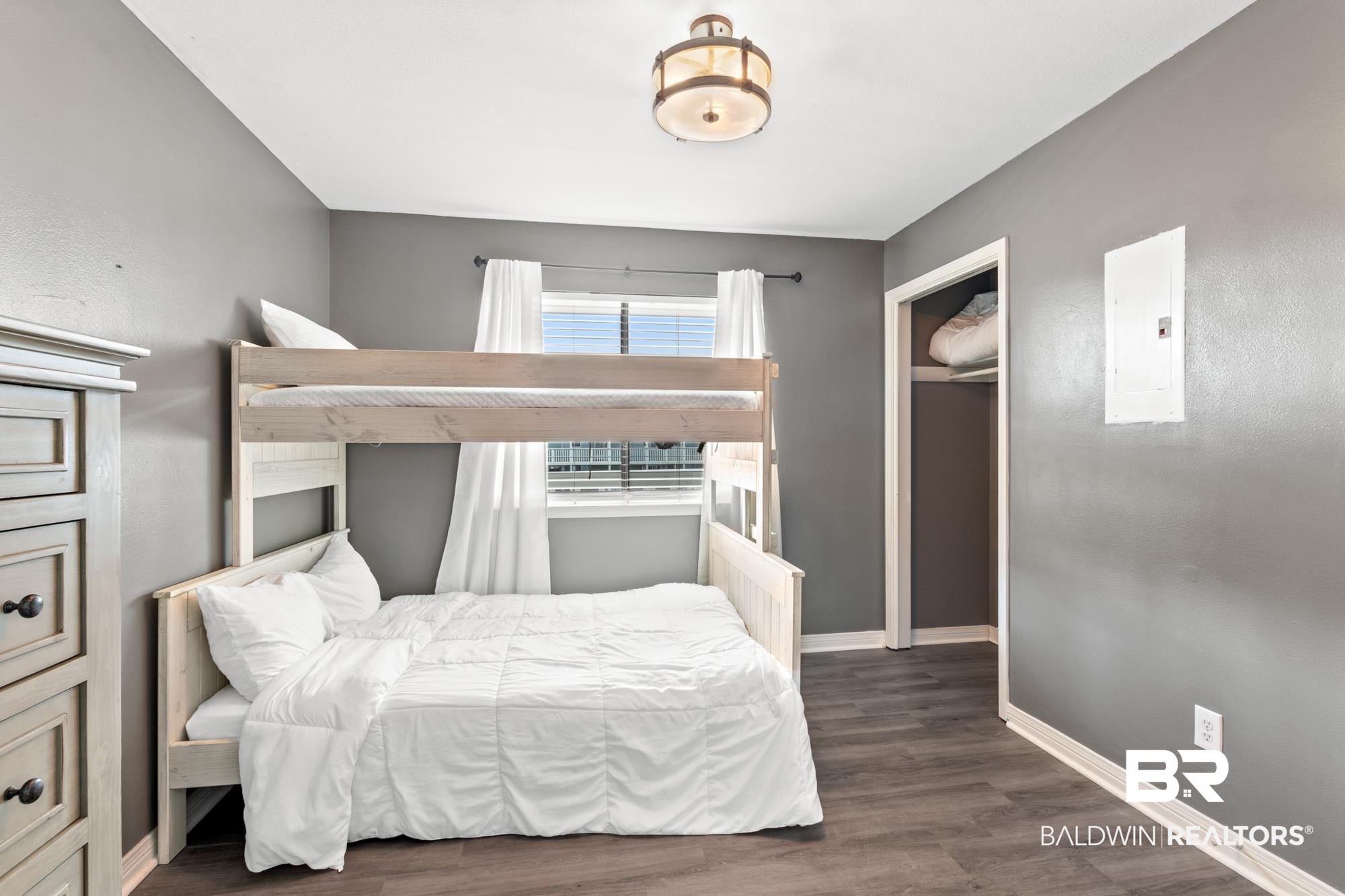 25925 -C Canal Road, Unit 203 Orange Beach, AL 36561 - Photo 15 of 57 Bedroom featuring electric panel and dark hardwood / wood-style floors