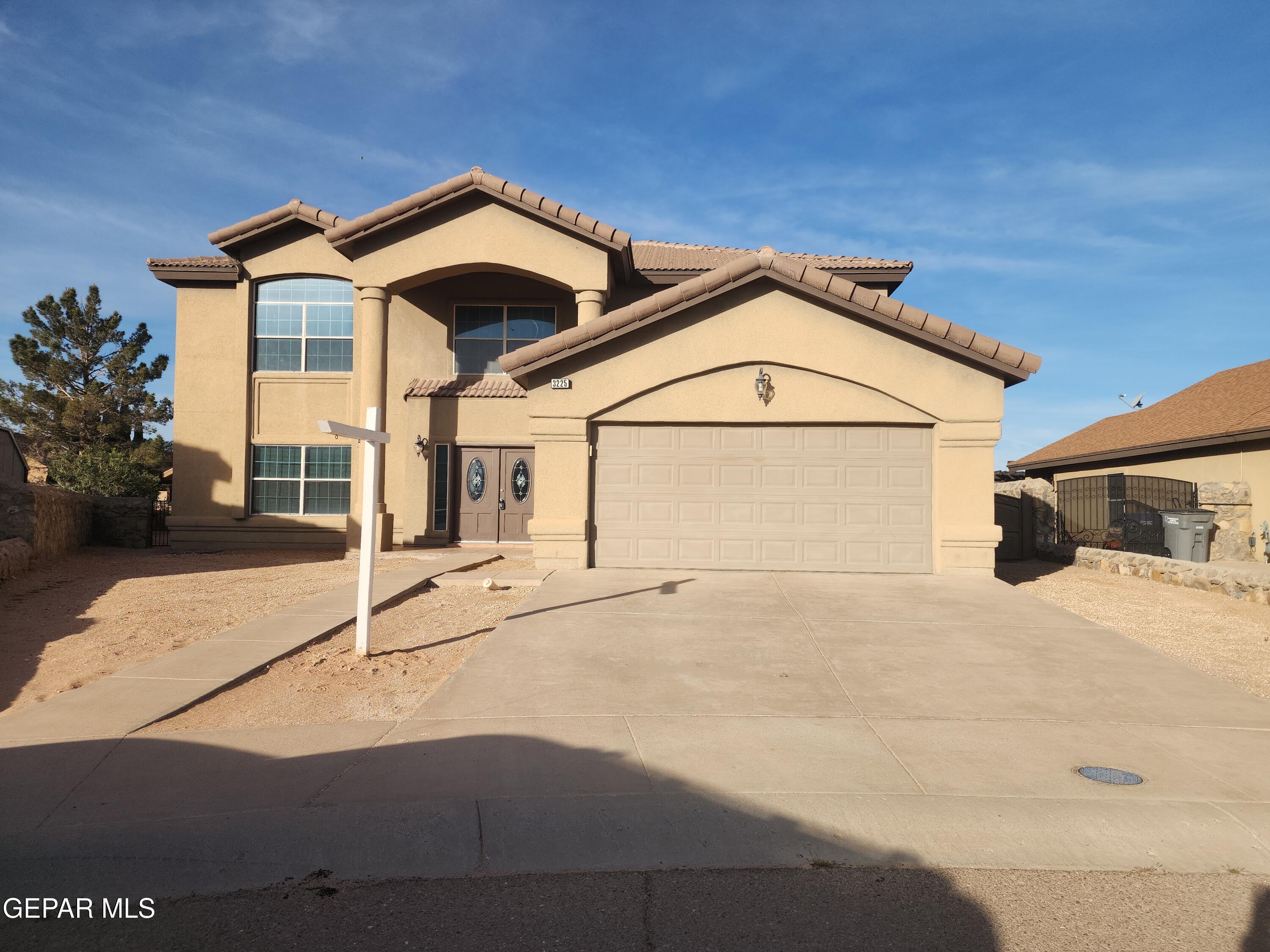 3225 Ivy Point Way El Paso, TX 79938 - Photo 1 of 35 a view of a large house with a street