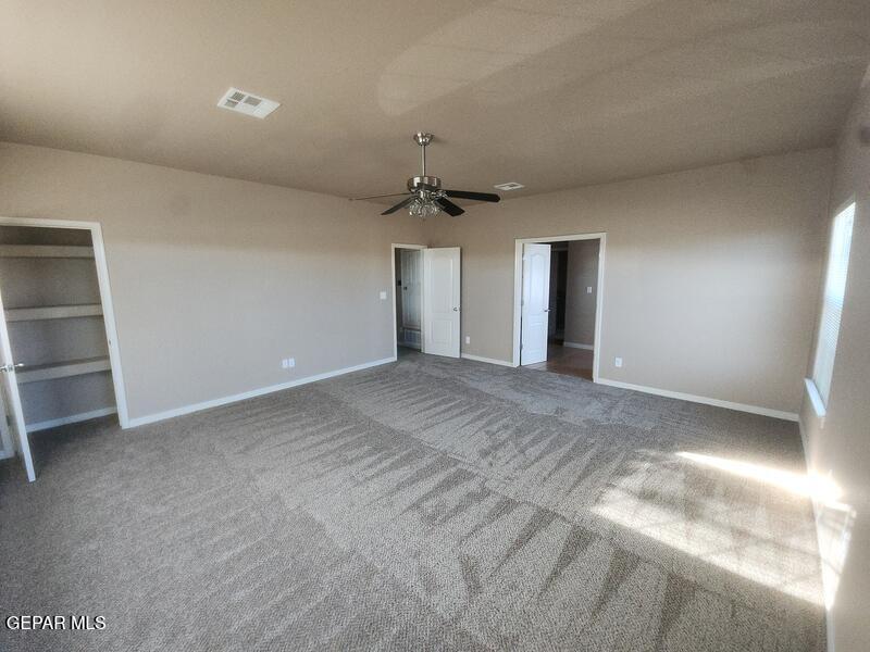 3225 Ivy Point Way El Paso, TX 79938 - Photo 17 of 35 a view of a livingroom with a ceiling fan window and a ceiling fan