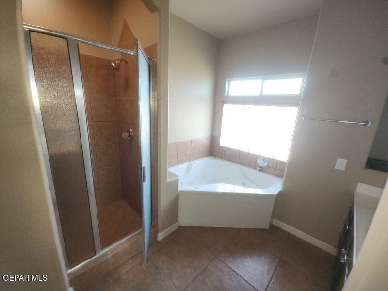 3225 Ivy Point Way El Paso, TX 79938 - Photo 19 of 35 a bathroom with a bathtub a shower a toilet and sink