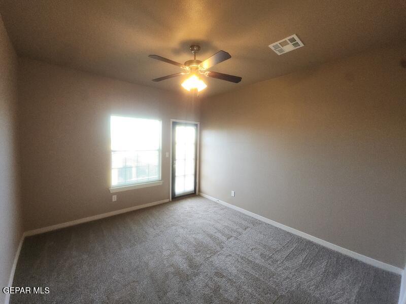 3225 Ivy Point Way El Paso, TX 79938 - Photo 24 of 35 a view of an empty room with a window