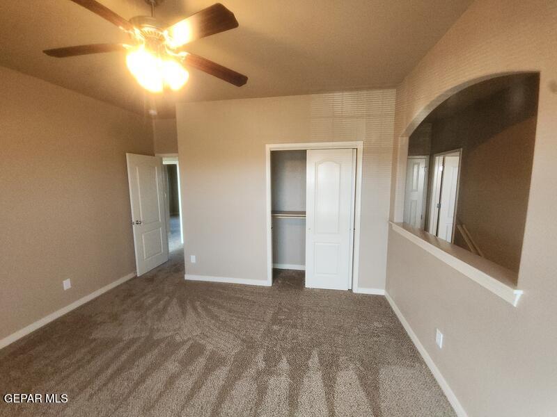 3225 Ivy Point Way El Paso, TX 79938 - Photo 29 of 35 a view of an empty room and chandelier fan