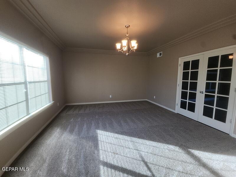 3225 Ivy Point Way El Paso, TX 79938 - Photo 3 of 35 wooden floor in an empty room with a window