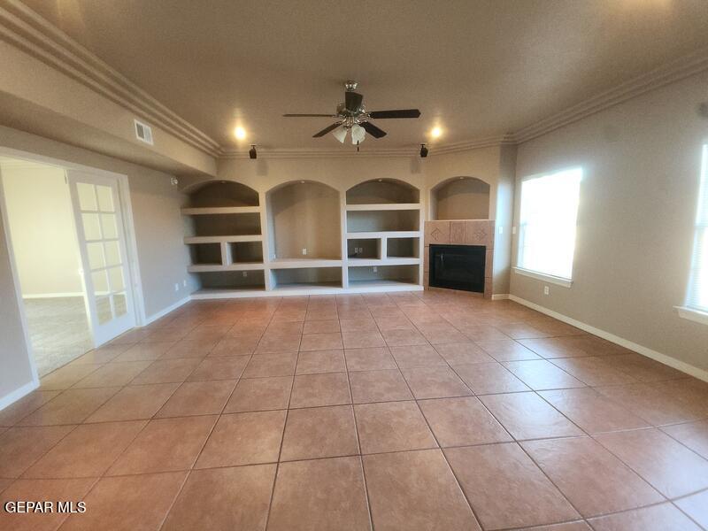3225 Ivy Point Way El Paso, TX 79938 - Photo 5 of 35 a view of a livingroom with furniture chandelier fan and windows