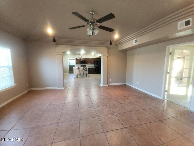 3225 Ivy Point Way El Paso, TX 79938 - Photo 6 of 35 a view of a livingroom with a ceiling fan and window