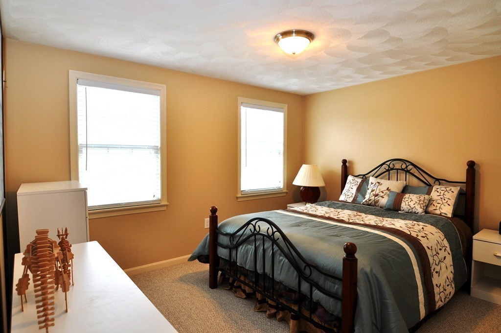 6 Dell Hollow Road Billerica, MA 01821 - Photo 11 of 25 a bedroom with a bed and window