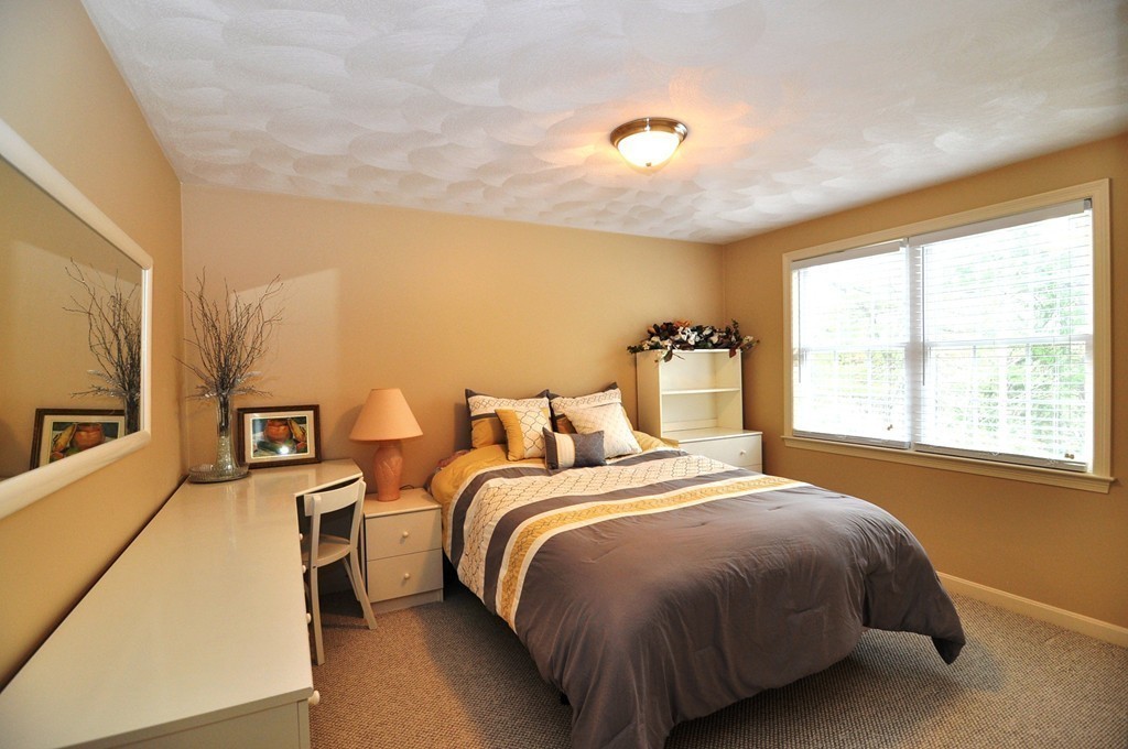 6 Dell Hollow Road Billerica, MA 01821 - Photo 12 of 25 a bedroom with two beds and a large window