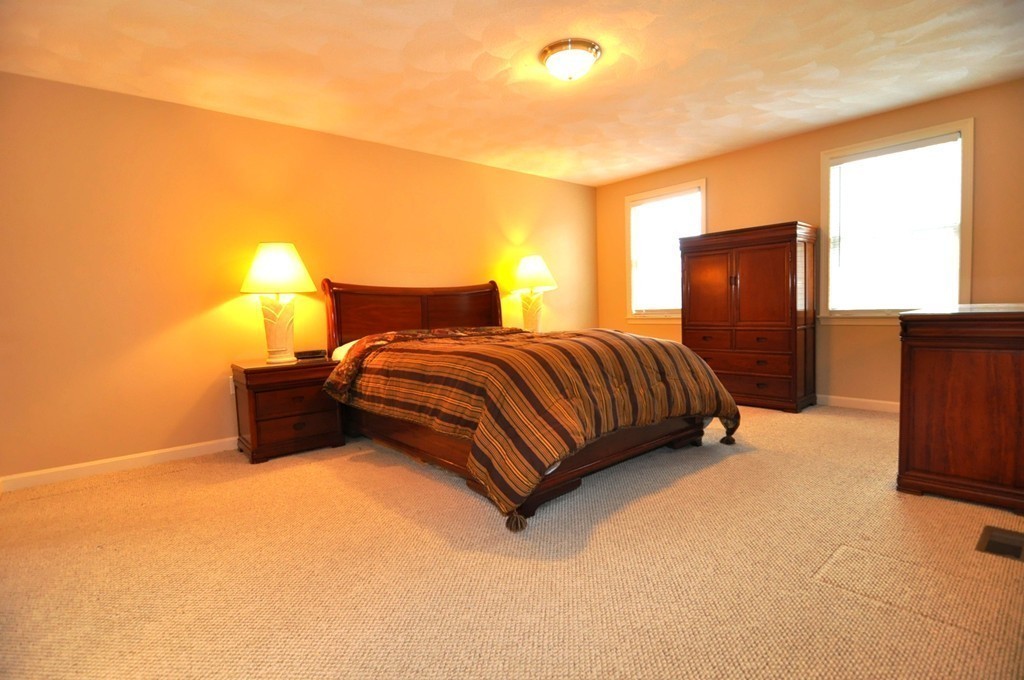 6 Dell Hollow Road Billerica, MA 01821 - Photo 13 of 25 a bedroom with a bed and lamp