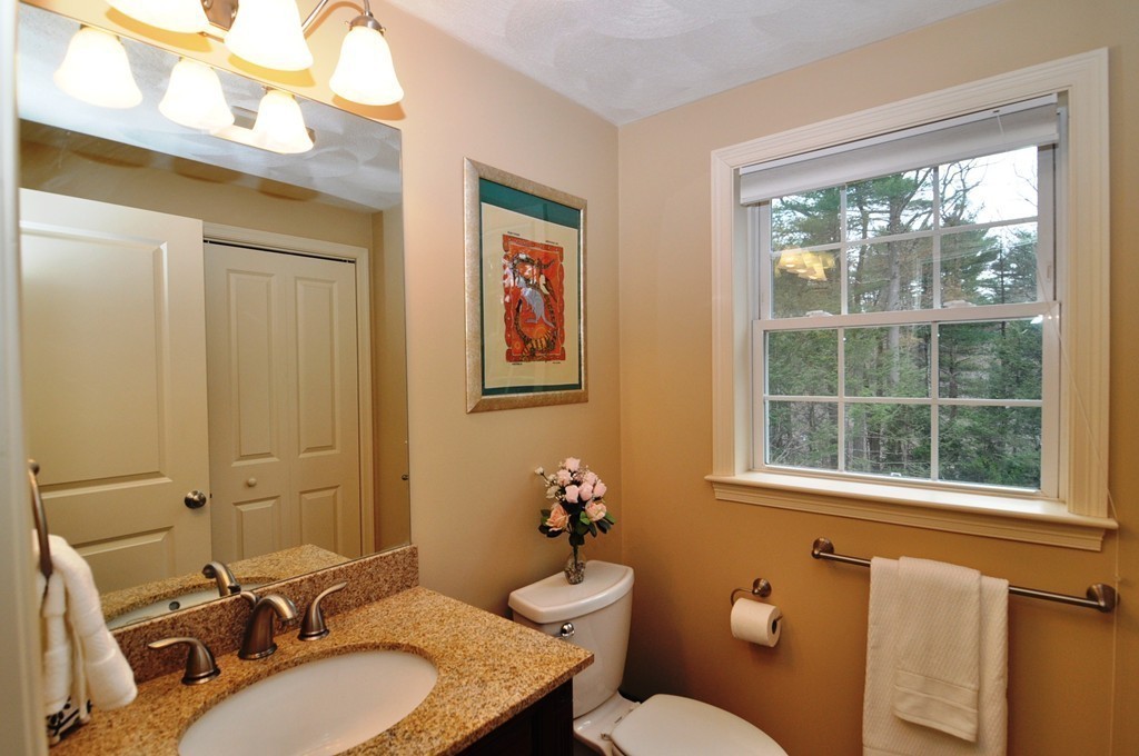6 Dell Hollow Road Billerica, MA 01821 - Photo 16 of 25 a bathroom with a granite countertop sink mirror and a toilet