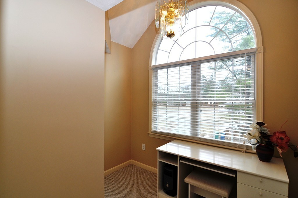 6 Dell Hollow Road Billerica, MA 01821 - Photo 19 of 25 a room with a window and a table