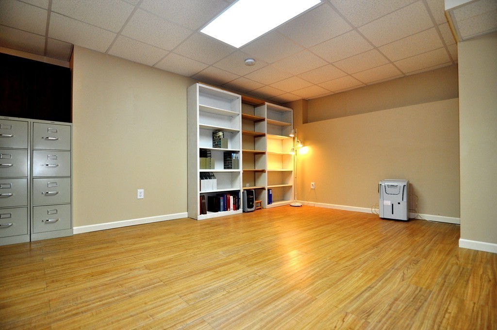 6 Dell Hollow Road Billerica, MA 01821 - Photo 22 of 25 a view of an empty room with wooden floor and closet