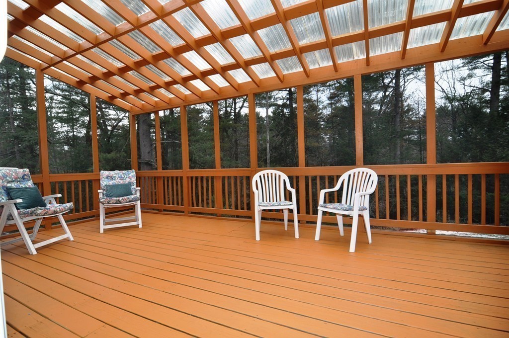 6 Dell Hollow Road Billerica, MA 01821 - Photo 23 of 25 a view of a chairs on wooden deck