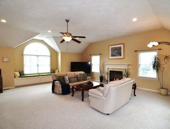 6 Dell Hollow Road Billerica, MA 01821 - Photo 4 of 25 a living room with furniture a fireplace and a flat screen tv