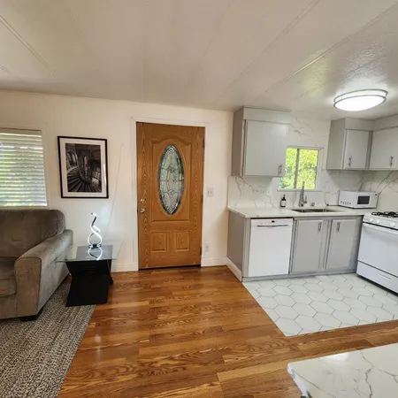 a view of kitchen with granite countertop lots of counter top space