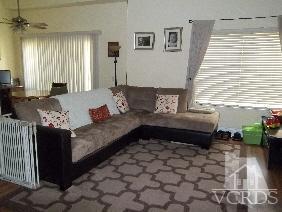 1724 Sinaloa Road, Unit 225 Simi Valley, CA 93065 - Photo 2 of 9 a living room with furniture and a fireplace