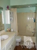 1724 Sinaloa Road, Unit 225 Simi Valley, CA 93065 - Photo 4 of 9 a bathroom with a sink toilet and shower