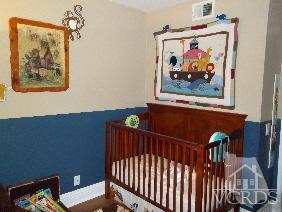 1724 Sinaloa Road, Unit 225 Simi Valley, CA 93065 - Photo 6 of 9 a view of a hallway with paintings on the wall