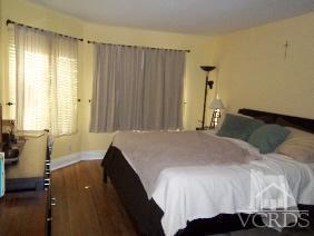 1724 Sinaloa Road, Unit 225 Simi Valley, CA 93065 - Photo 7 of 9 a bedroom with a bed and a window