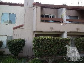 1724 Sinaloa Road, Unit 225 Simi Valley, CA 93065 - Photo 9 of 9 a front view of a house with a garden