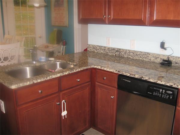 46 Daniels Road Charlton, MA 01507 - Photo 15 of 30 a kitchen with granite countertop a sink and a stove