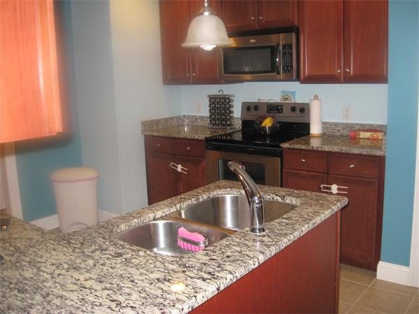 46 Daniels Road Charlton, MA 01507 - Photo 16 of 30 a kitchen with granite countertop a sink and a stove
