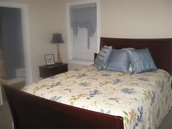 46 Daniels Road Charlton, MA 01507 - Photo 20 of 30 a bed sitting in a bedroom and a lamp