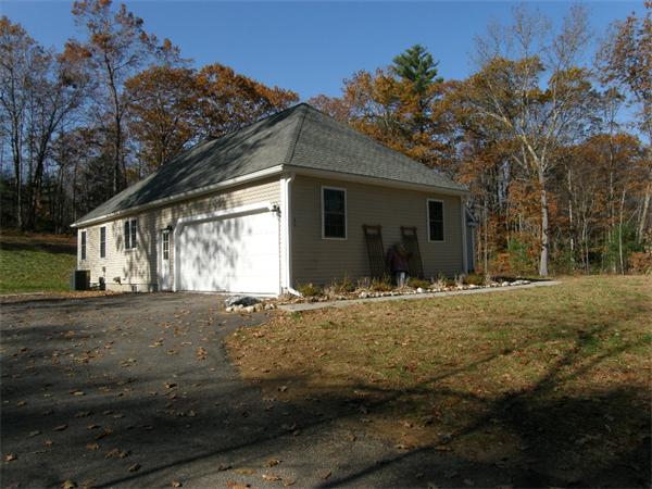 46 Daniels Road Charlton, MA 01507 - Photo 2 of 30 a front view of a house with a yard