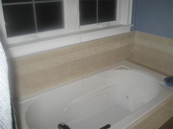 46 Daniels Road Charlton, MA 01507 - Photo 23 of 30 a bathroom with a bathtub