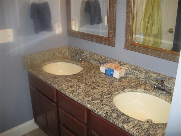 46 Daniels Road Charlton, MA 01507 - Photo 24 of 30 a bathroom with a granite countertop sink and a mirror