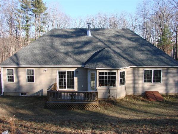 46 Daniels Road Charlton, MA 01507 - Photo 4 of 30 a front view of a house with a yard