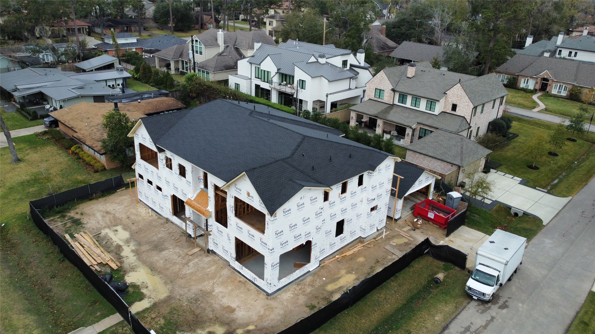 8002 Anadell Street Houston, TX 77055 - Photo 4 of 6 an aerial view of residential houses with wooden floor and lake view