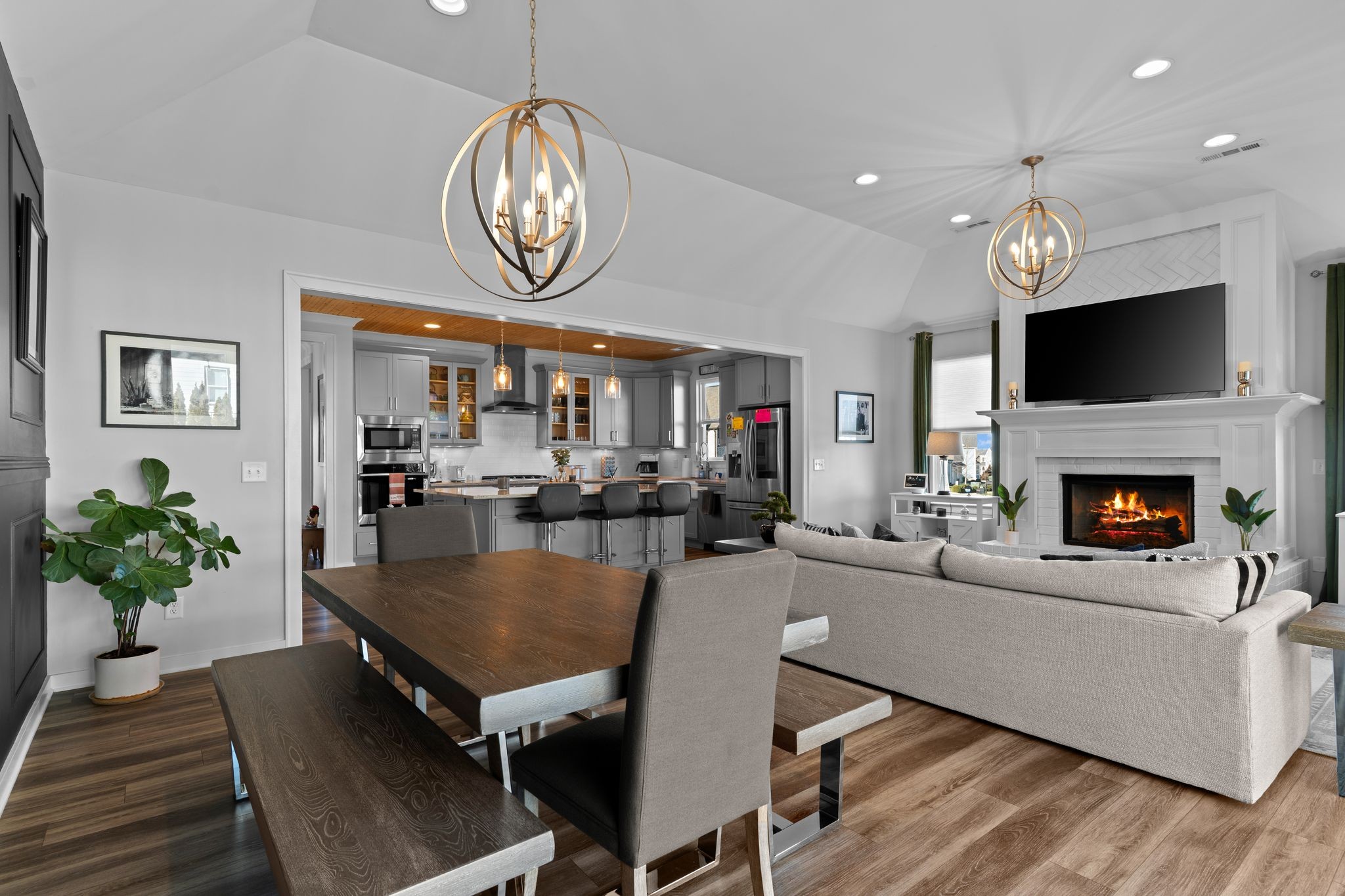 257 Croft Way Mount Juliet, TN 37122 - Photo 17 of 47 a living room with dining table a flat screen tv and a fireplace