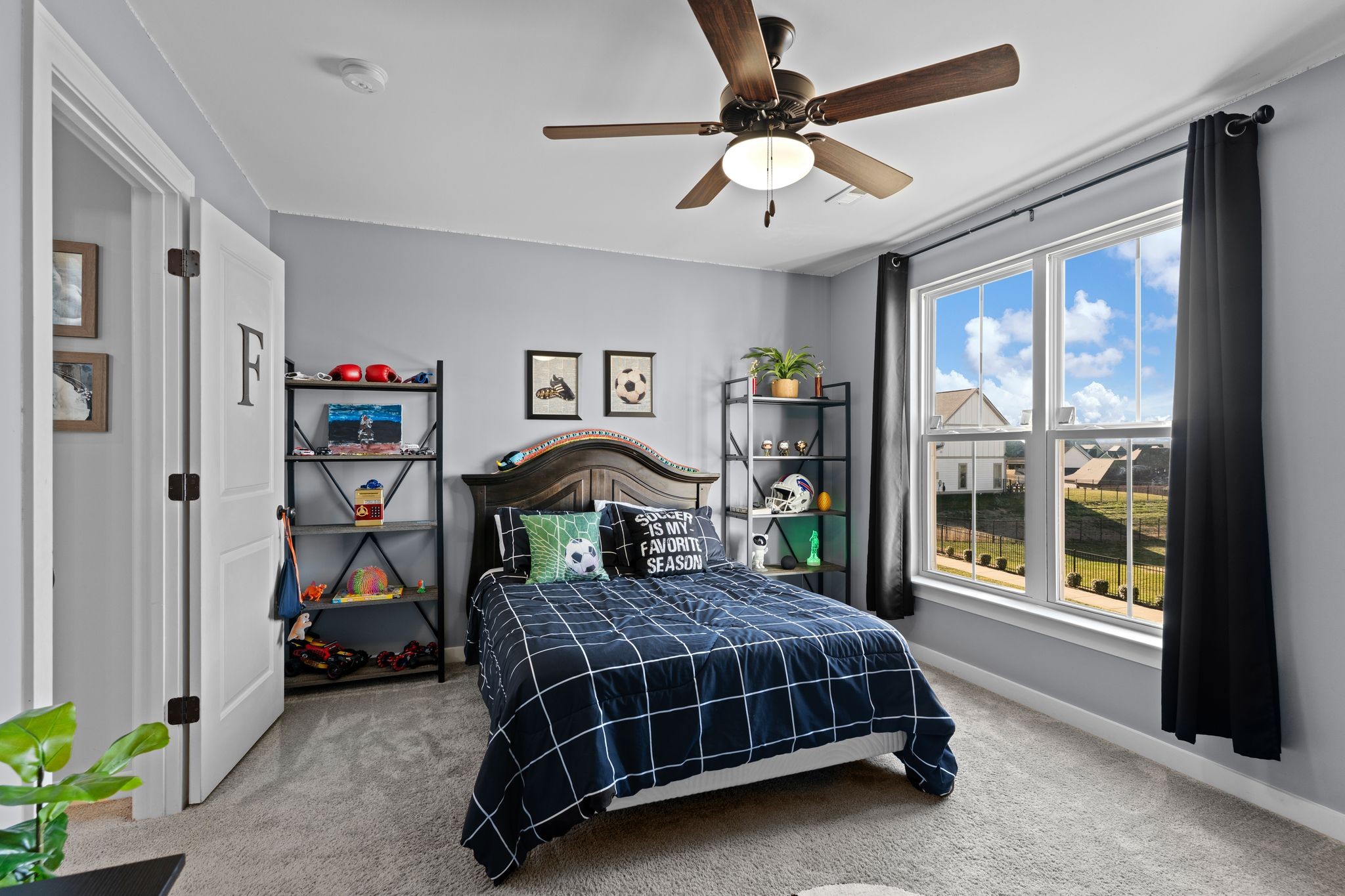 257 Croft Way Mount Juliet, TN 37122 - Photo 30 of 47 a bedroom with a bed a dresser and a chandelier