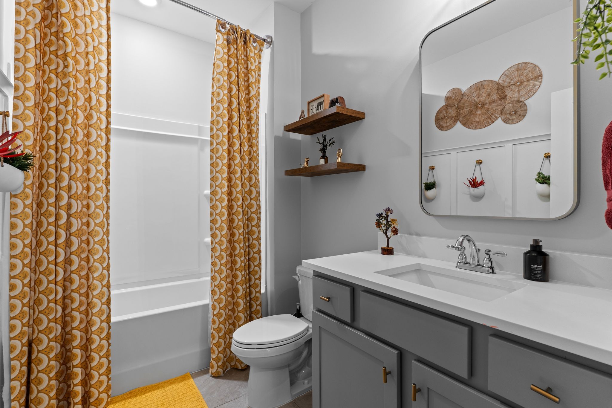 257 Croft Way Mount Juliet, TN 37122 - Photo 7 of 47 a bathroom with a sink a toilet and a shower curtain