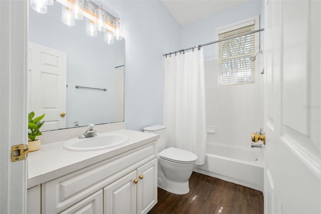 5213 Southwest 91 Terrace, Unit B Gainesville, FL 32608 - Photo 20 of 38 a bathroom with a sink a toilet and shower