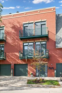 a living room with furniture kitchen view and a fireplace