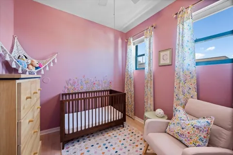 a bedroom with furniture and a rug
