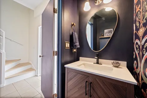 a view of a couches and a table and chairs in the roof deck