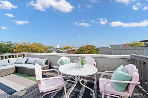 a view of a terrace with furniture
