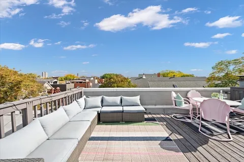 a couple of potted plants sitting in front of a door