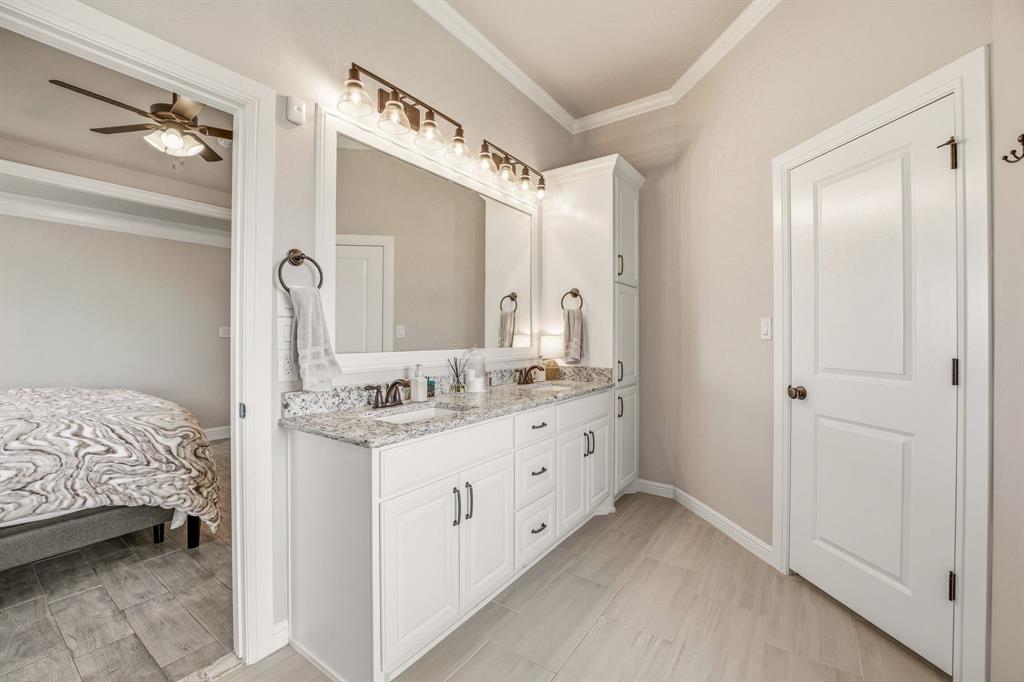 601 Violet Tolar, TX 76476 - Photo 14 of 26 a bathroom with a sink and a mirror