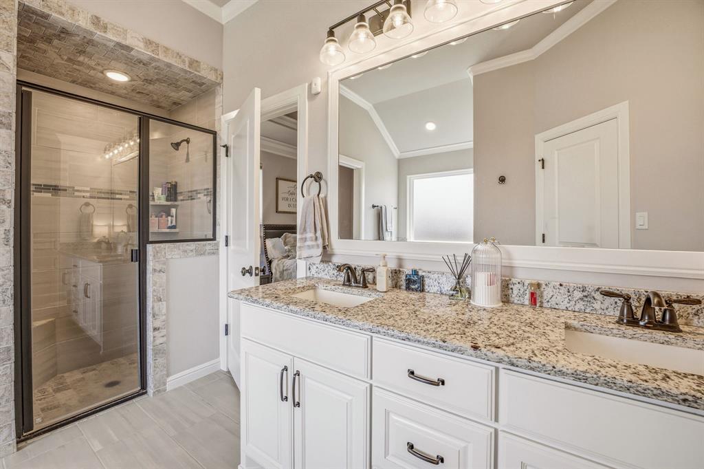 601 Violet Tolar, TX 76476 - Photo 15 of 26 a bathroom with a granite countertop double vanity sink shower and a mirror