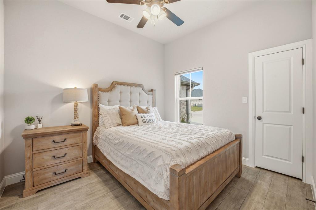 601 Violet Tolar, TX 76476 - Photo 16 of 26 a bedroom with a bed and a dresser