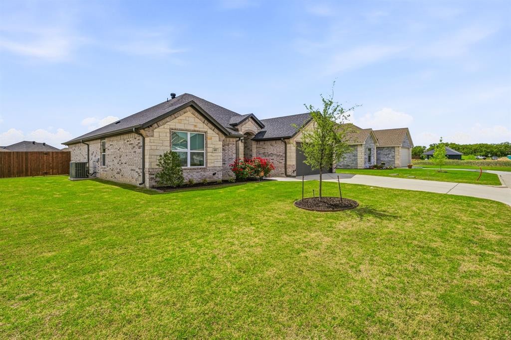 601 Violet Tolar, TX 76476 - Photo 23 of 26 a view of a house with a yard and sitting area