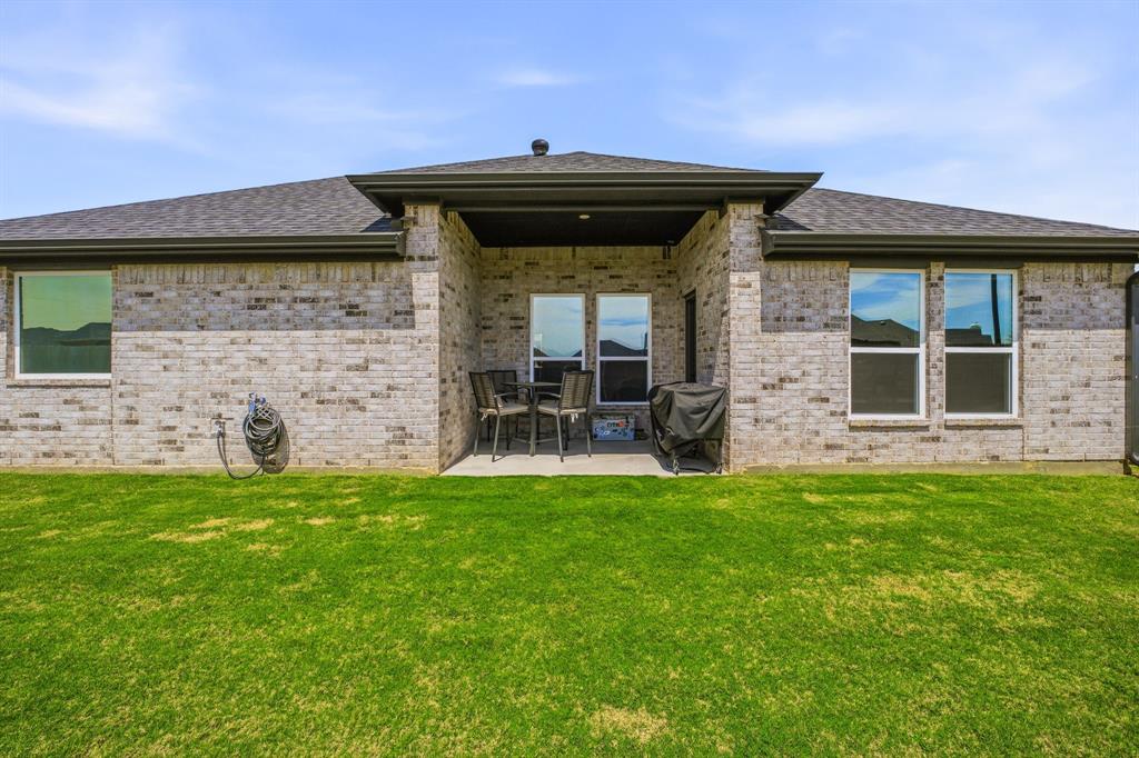 601 Violet Tolar, TX 76476 - Photo 24 of 26 a view of a wooden door and chair in the patio