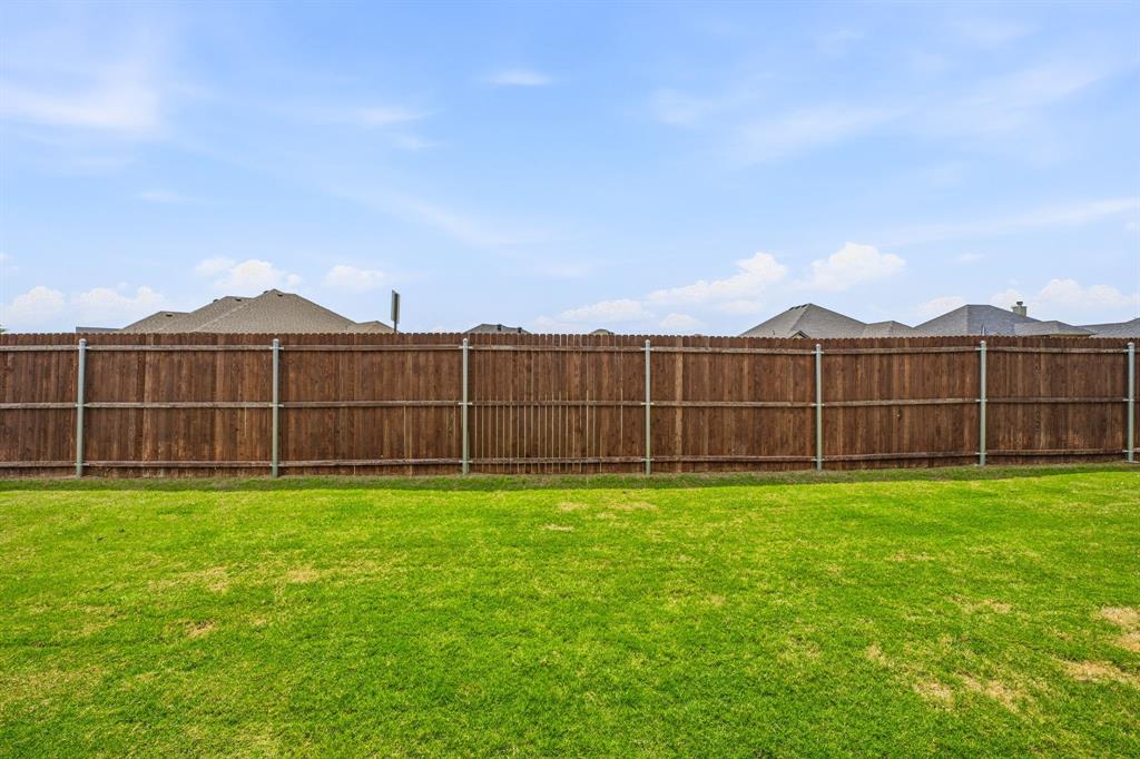601 Violet Tolar, TX 76476 - Photo 26 of 26 a view of a backyard with a garden