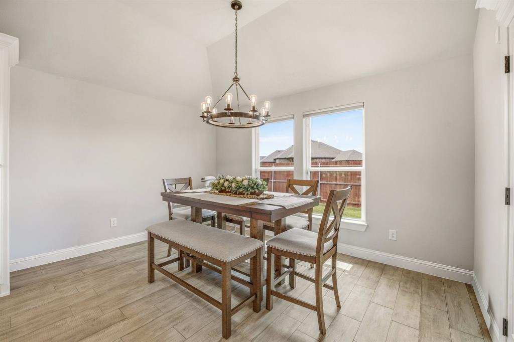 601 Violet Tolar, TX 76476 - Photo 8 of 26 a view of a dining room with furniture wooden floor and chandelier