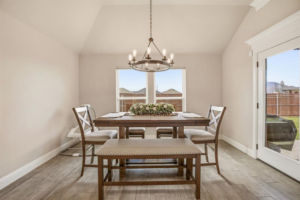 601 Violet Tolar, TX 76476 - Photo 9 of 26 a view of a dining room with furniture window and wooden floor