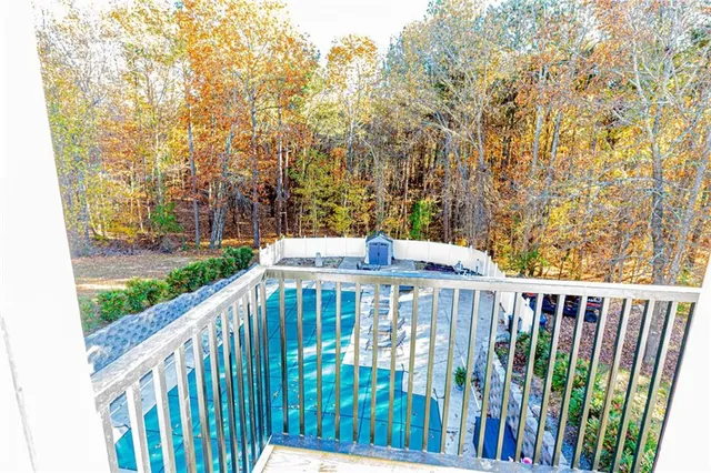 a kitchen with stainless steel appliances a refrigerator and a stove top oven